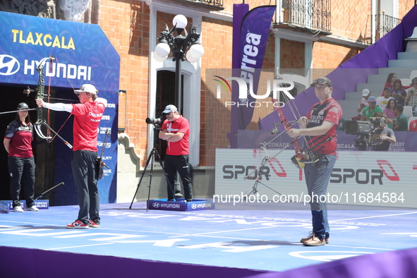 James Lutz of the United States and Mathias Fullerton of Denmark compete during the men's compound gold medal match on the second day of the...