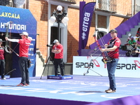 James Lutz of the United States and Mathias Fullerton of Denmark compete during the men's compound gold medal match on the second day of the...