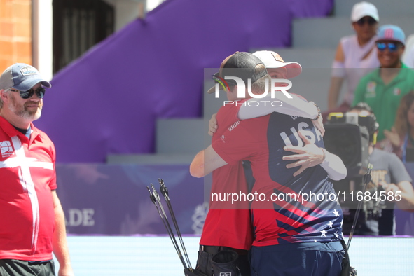 James Lutz of the United States and Mathias Fullerton of Denmark compete during the men's compound gold medal match on the second day of the...