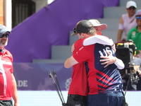 James Lutz of the United States and Mathias Fullerton of Denmark compete during the men's compound gold medal match on the second day of the...