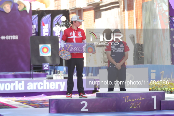 Second place Mathias Fullerton of Denmark and gold medalist James Lutz of the United States stand during the medal ceremony after the men's...