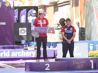 Second place Mathias Fullerton of Denmark and gold medalist James Lutz of the United States stand during the medal ceremony after the men's...