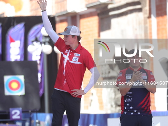 Second place Mathias Fullerton of Denmark and gold medalist James Lutz of the United States stand during the medal ceremony after the men's...