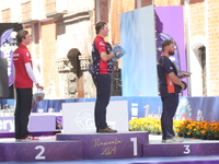 (L-R) Silver medalist Mathias Fullerton of Denmark, gold medalist James Lutz of the United States, and bronze medalist Mike Schloesser of th...