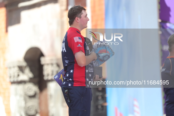 Gold medalist James Lutz of the United States stands during the medal ceremony after the men's compound final match on the second day of the...