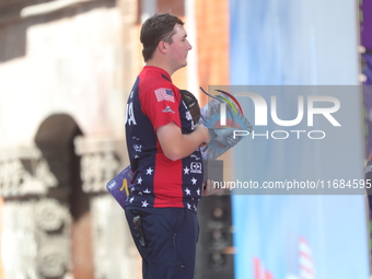 Gold medalist James Lutz of the United States stands during the medal ceremony after the men's compound final match on the second day of the...