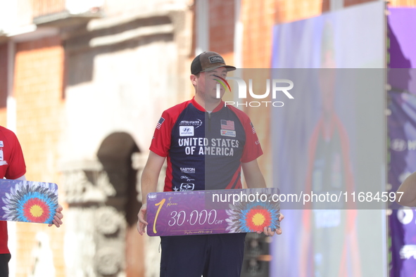 Gold medalist James Lutz of the United States stands during the medal ceremony after the men's compound final match on the second day of the...