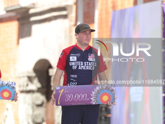 Gold medalist James Lutz of the United States stands during the medal ceremony after the men's compound final match on the second day of the...