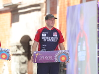 Gold medalist James Lutz of the United States stands during the medal ceremony after the men's compound final match on the second day of the...