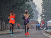 Participants run during the Kashmir Marathon on the banks of Dal Lake in Srinagar, Jammu and Kashmir, on October 20, 2024. Kashmir hosts its...