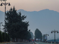 Participants run during the Kashmir Marathon on the banks of Dal Lake in Srinagar, Jammu and Kashmir, on October 20, 2024. Kashmir hosts its...