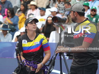 Sara Lopez of Colombia competes against Meeri-Marita Paas of Estonia (not in picture) during the women's compound gold medal match on the se...