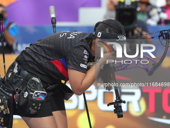 Sara Lopez of Colombia competes against Meeri-Marita Paas of Estonia (not in picture) during the women's compound gold medal match on the se...