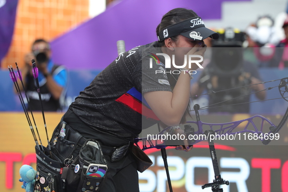 Sara Lopez of Colombia competes against Meeri-Marita Paas of Estonia (not in picture) during the women's compound gold medal match on the se...