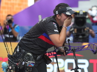 Sara Lopez of Colombia competes against Meeri-Marita Paas of Estonia (not in picture) during the women's compound gold medal match on the se...