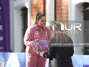 Bronze medalist Dafne Quintero of Mexico participates in the medal ceremony on the second day of the Tlaxcala 2024 Archery World Cup Final i...