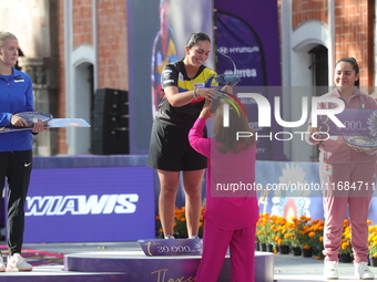 (L-R) Silver medalist Meeri-Marita Paas of Estonia, gold medalist Sara Lopez of Colombia, and bronze medalist Dafne Quintero of Mexico parti...