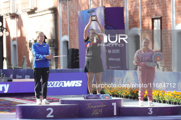 (L-R) Silver medalist Meeri-Marita Paas of Estonia, gold medalist Sara Lopez of Colombia, and bronze medalist Dafne Quintero of Mexico parti...