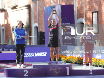 (L-R) Silver medalist Meeri-Marita Paas of Estonia, gold medalist Sara Lopez of Colombia, and bronze medalist Dafne Quintero of Mexico parti...