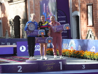 (L-R) Silver medalist Meeri-Marita Paas of Estonia, gold medalist Sara Lopez of Colombia, and bronze medalist Dafne Quintero of Mexico parti...