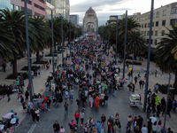 People in disguise take part in the annual Zombie Walk 2024 from the Monument to the Revolution to the main square Zocalo in Mexico City, Me...