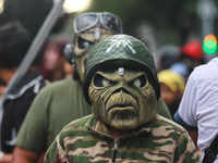 A person in disguise takes part in the annual Zombie walk from the Monument to the Revolution to the main square Zocalo in Mexico City, Mexi...