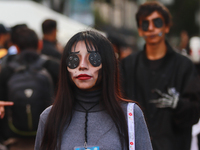 A person in disguise takes part in the annual Zombie walk from the Monument to the Revolution to the main square Zocalo in Mexico City, Mexi...