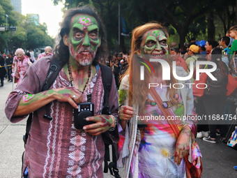 People in disguise take part in the annual Zombie Walk 2024 from the Monument to the Revolution to the main square Zocalo in Mexico City, Me...