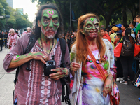 People in disguise take part in the annual Zombie Walk 2024 from the Monument to the Revolution to the main square Zocalo in Mexico City, Me...