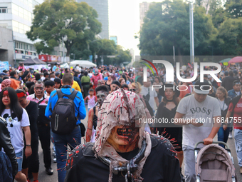 People in disguise take part in the annual Zombie Walk 2024 from the Monument to the Revolution to the main square Zocalo in Mexico City, Me...