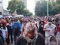 People in disguise take part in the annual Zombie Walk 2024 from the Monument to the Revolution to the main square Zocalo in Mexico City, Me...