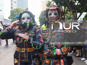 People in disguise take part in the annual Zombie Walk 2024 from the Monument to the Revolution to the main square Zocalo in Mexico City, Me...