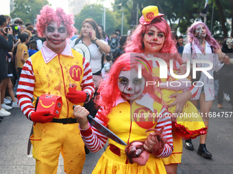 People in disguise take part in the annual Zombie Walk 2024 from the Monument to the Revolution to the main square Zocalo in Mexico City, Me...