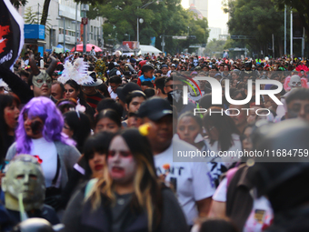 People in disguise take part in the annual Zombie Walk 2024 from the Monument to the Revolution to the main square Zocalo in Mexico City, Me...