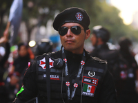 A person in disguise takes part in the annual Zombie walk from the Monument to the Revolution to the main square Zocalo in Mexico City, Mexi...