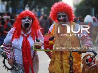 People in disguise take part in the annual Zombie Walk 2024 from the Monument to the Revolution to the main square Zocalo in Mexico City, Me...