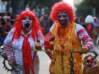 People in disguise take part in the annual Zombie Walk 2024 from the Monument to the Revolution to the main square Zocalo in Mexico City, Me...