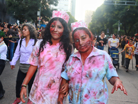 People in disguise take part in the annual Zombie Walk 2024 from the Monument to the Revolution to the main square Zocalo in Mexico City, Me...