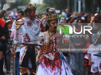 People in disguise take part in the annual Zombie Walk 2024 from the Monument to the Revolution to the main square Zocalo in Mexico City, Me...