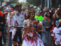 People in disguise take part in the annual Zombie Walk 2024 from the Monument to the Revolution to the main square Zocalo in Mexico City, Me...