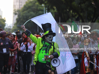 People in disguise take part in the annual Zombie Walk 2024 from the Monument to the Revolution to the main square Zocalo in Mexico City, Me...