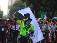 People in disguise take part in the annual Zombie Walk 2024 from the Monument to the Revolution to the main square Zocalo in Mexico City, Me...