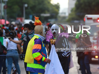 People in disguise take part in the annual Zombie Walk 2024 from the Monument to the Revolution to the main square Zocalo in Mexico City, Me...