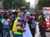 People in disguise take part in the annual Zombie Walk 2024 from the Monument to the Revolution to the main square Zocalo in Mexico City, Me...