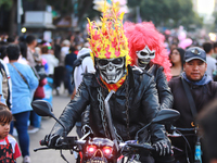 A person in disguise takes part in the annual Zombie walk from the Monument to the Revolution to the main square Zocalo in Mexico City, Mexi...