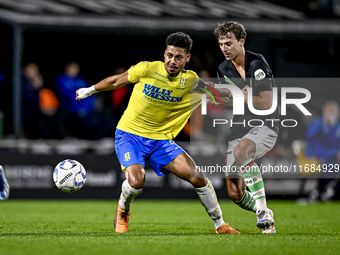 RKC forward Richonell Margaret and FC Twente midfielder Youri Regeer play during the match RKC - Twente at the Mandemakers Stadium in Waalwi...