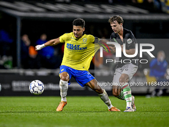 RKC forward Richonell Margaret and FC Twente midfielder Youri Regeer play during the match RKC - Twente at the Mandemakers Stadium in Waalwi...