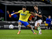 RKC forward Richonell Margaret and FC Twente midfielder Youri Regeer play during the match RKC - Twente at the Mandemakers Stadium in Waalwi...