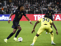 Juventus midfielder Khephren Thuram (19) fights for the ball against Lazio defender Nuno Tavares (30) during the Serie A football match numb...