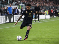 Juventus midfielder Douglas Luiz (26) shoots the ball during the Serie A football match number 8, Juventus versus Lazio, at the Allianz Stad...